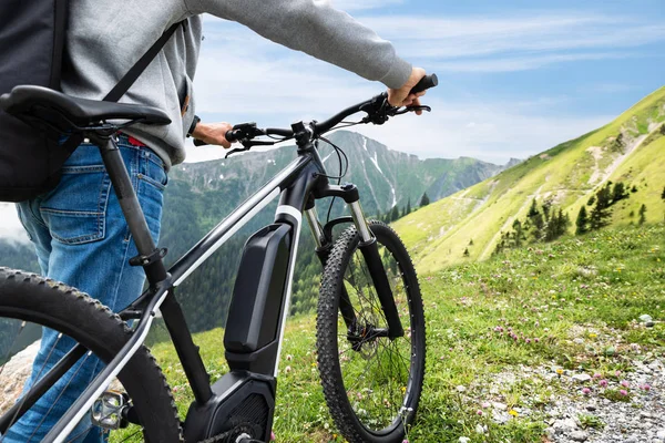 Main On Mountain With His electric bike